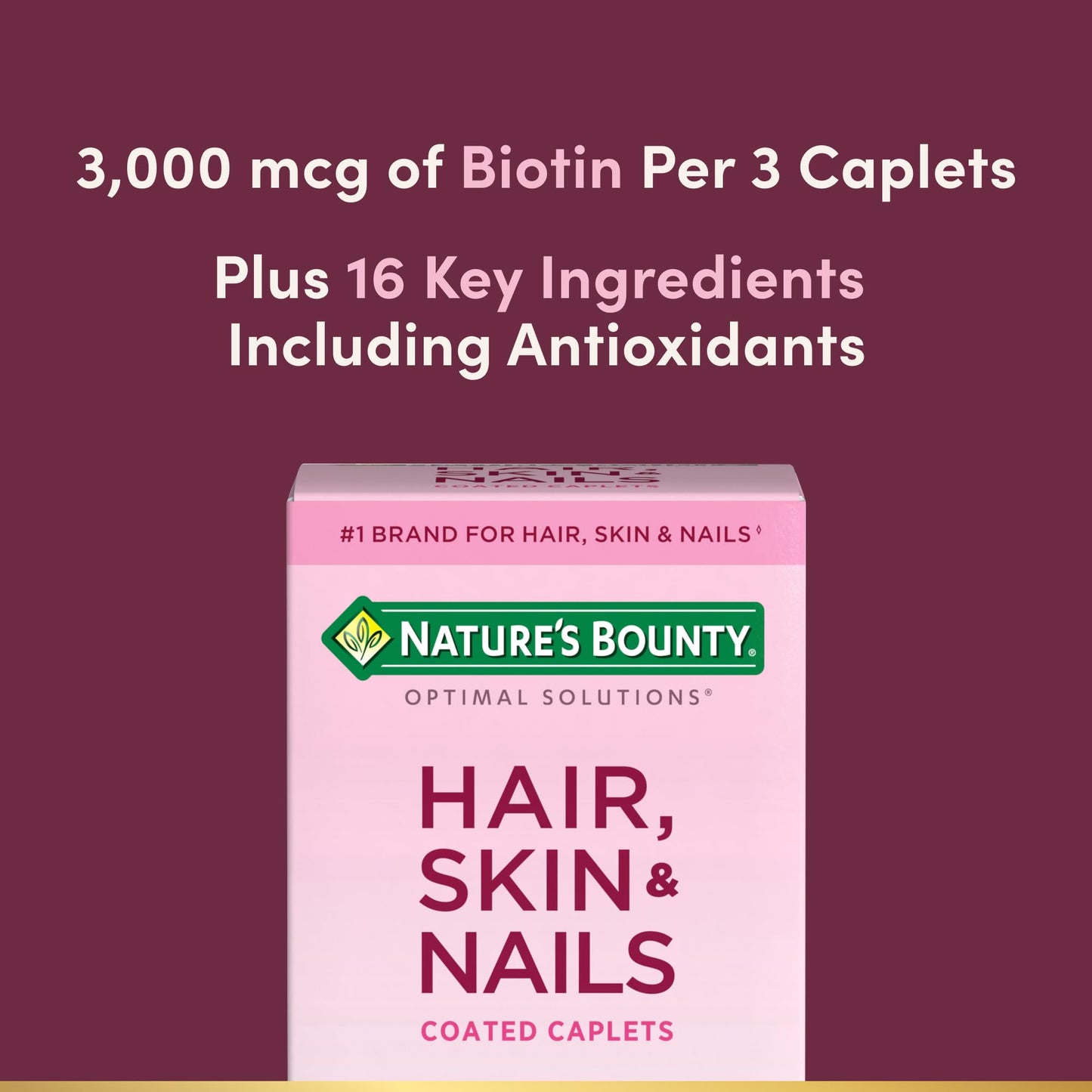 Close up view of the Nature's Bounty biotin supplement caplets showing the smooth outer coating