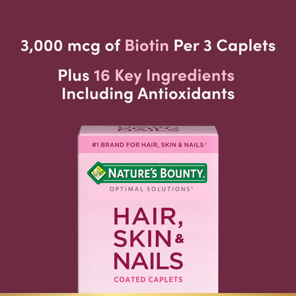 Close up view of the Nature's Bounty biotin supplement caplets showing the smooth outer coating