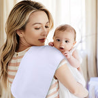 Clean white baby burp cloths spread out for daily use