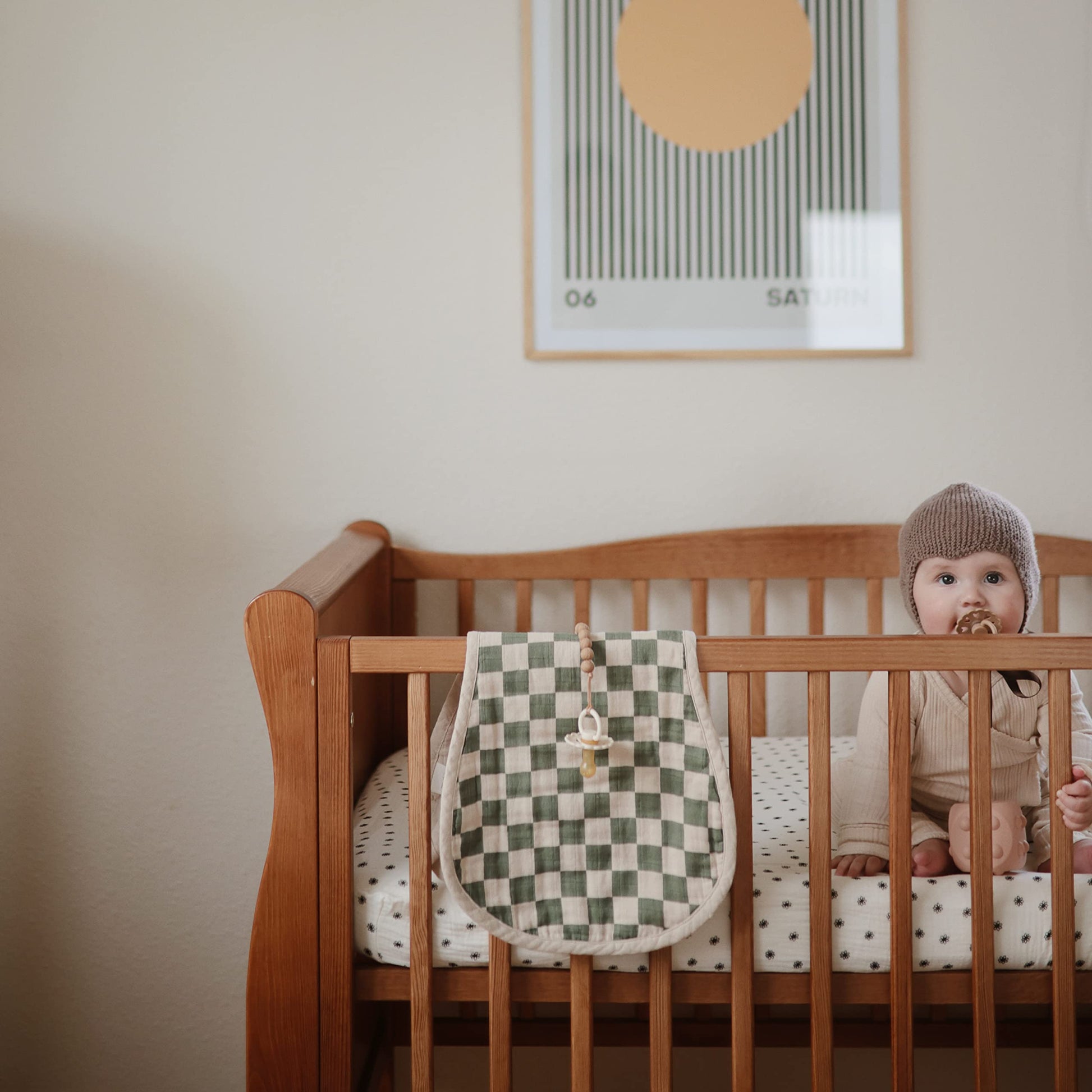 Top view of two soft muslin burp cloths for infants