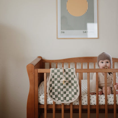 Top view of two soft muslin burp cloths for infants