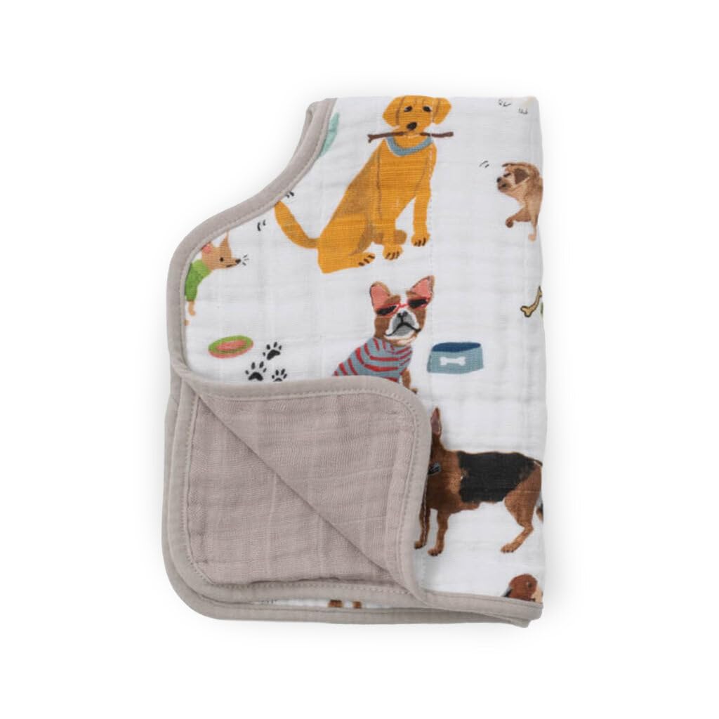 Parent using Little Unicorn burp cloth over shoulder for baby