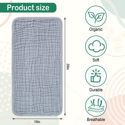 Ten pieces of gender neutral multi-layer muslin cloths neatly folded together.