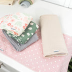 Gerber baby burp cloths showing floral and solid patterns