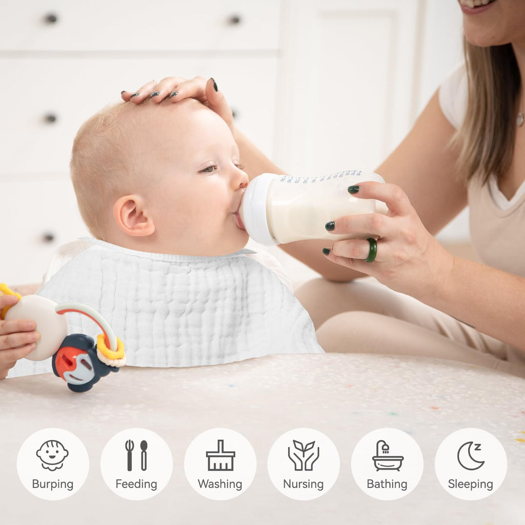 White Synrroe burp cloths neatly stacked for nursery organization