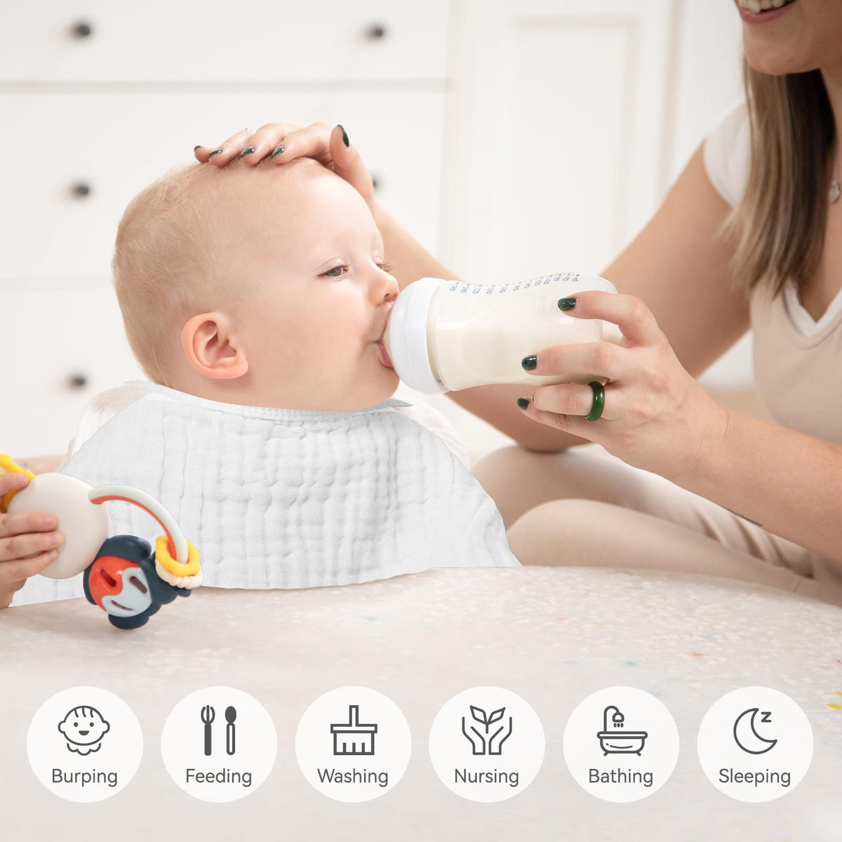 White Synrroe burp cloths neatly stacked for nursery organization