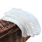 Four pack of white muslin baby cloths