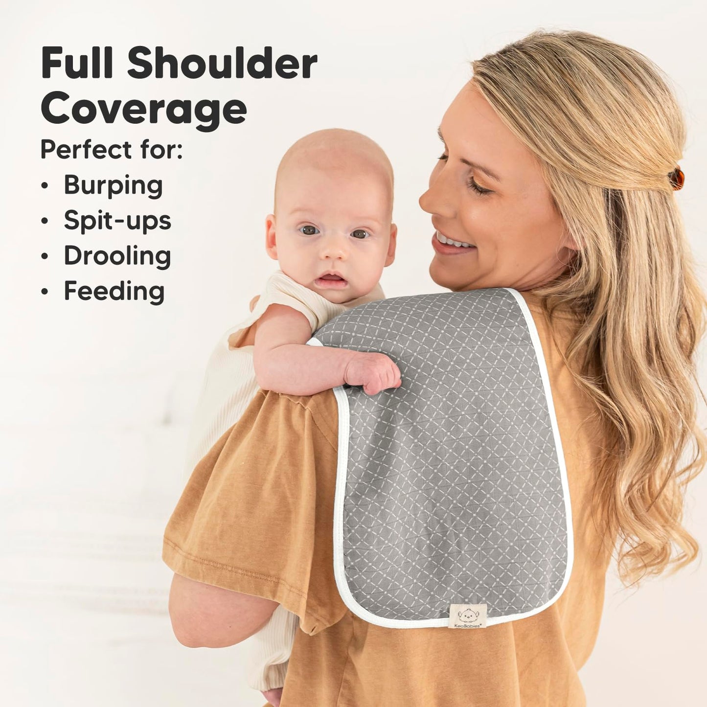 KeaBabies burp cloths draped over adult shoulder for size reference