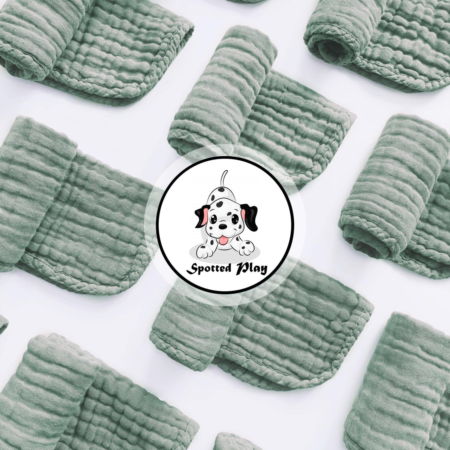 Twelve pack of extra soft green muslin spit up rags neatly stacked for nursery organization.