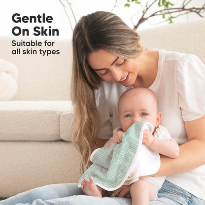 Parent using KeaBabies soft burp cloth with a baby
