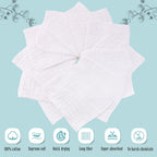 Stacked white cotton muslin burp cloths for baby