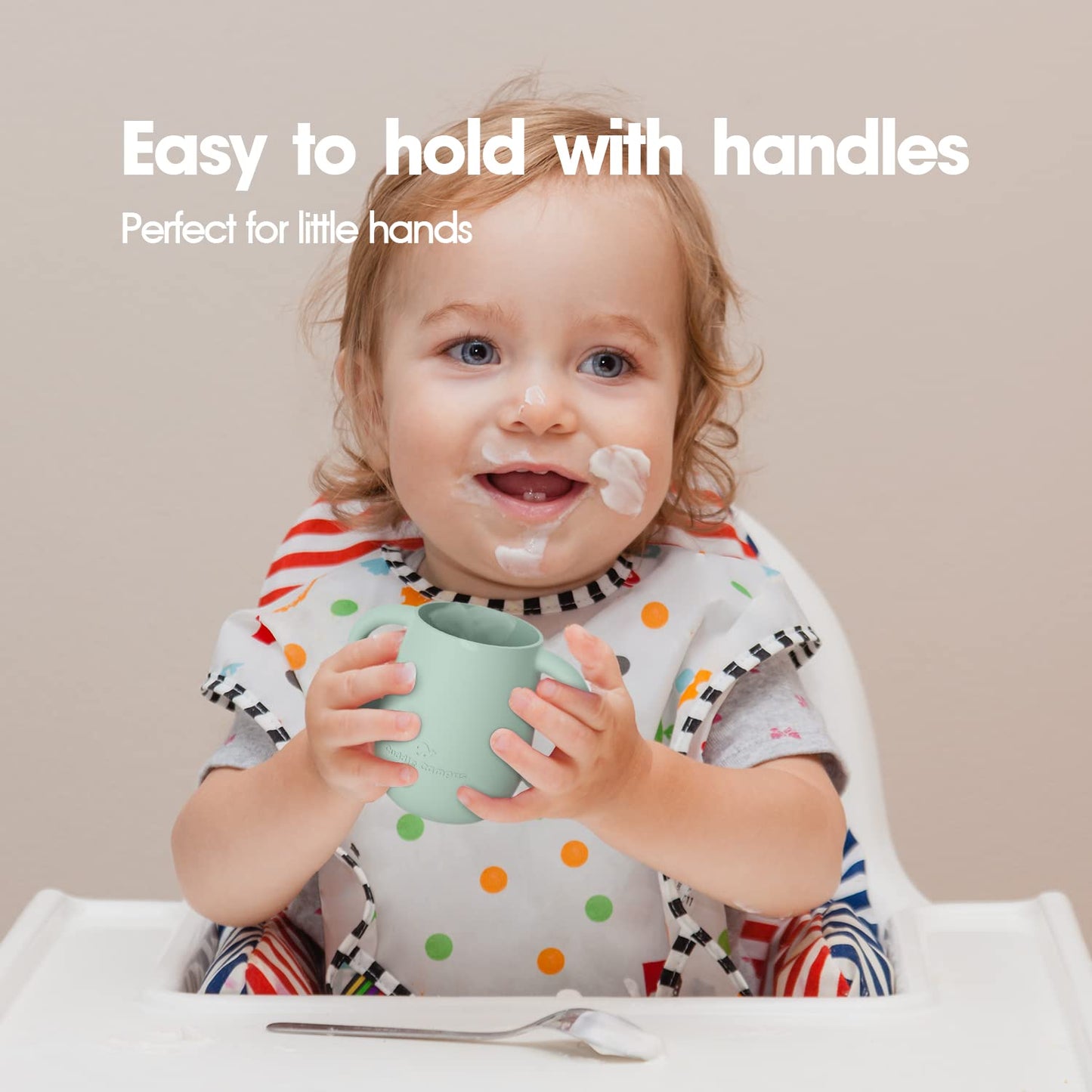 Close up view of the dual easy grip handles on the four ounce toddler cup