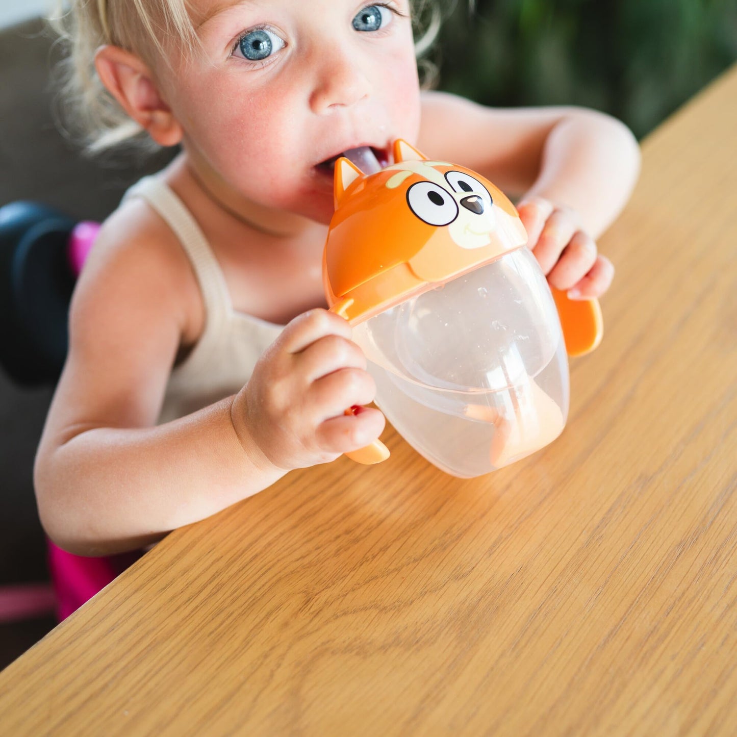Side profile of The First Years Bingo weighted straw cup with handles