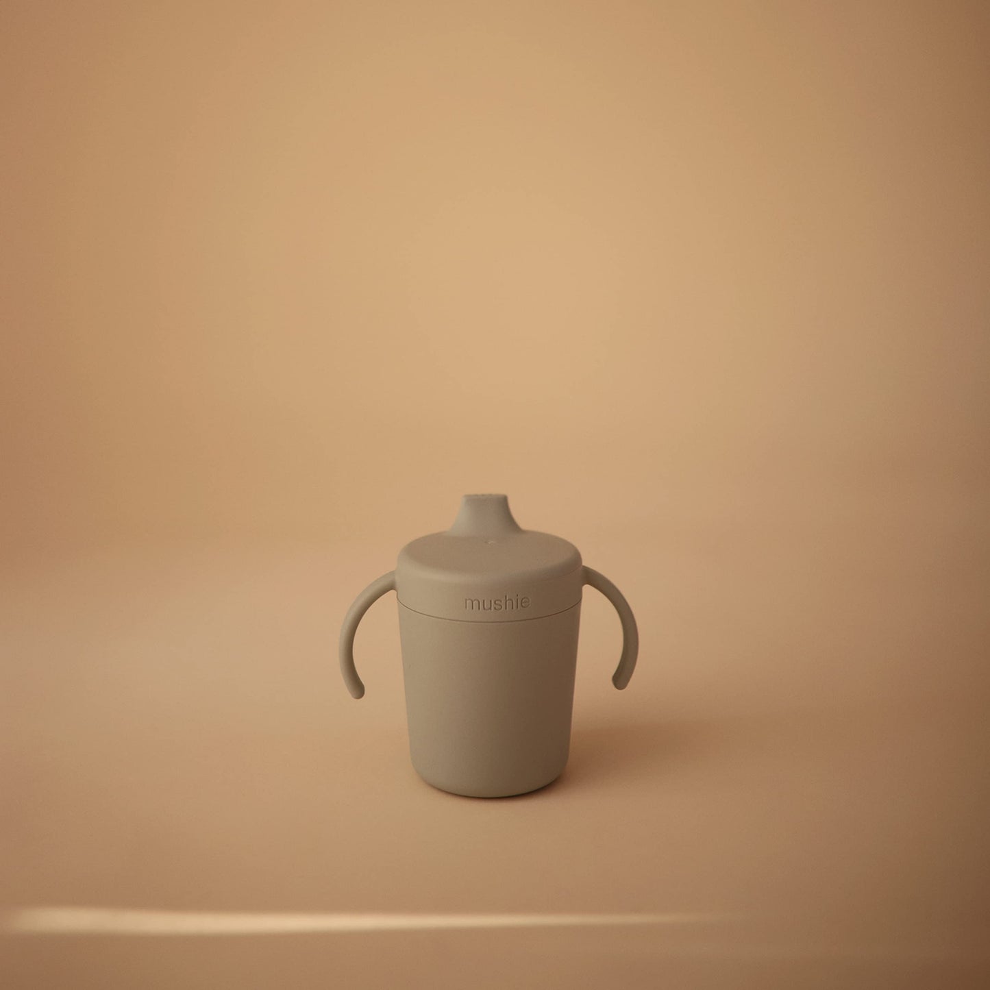 Danish designed infant training sipper in pastel sage green color