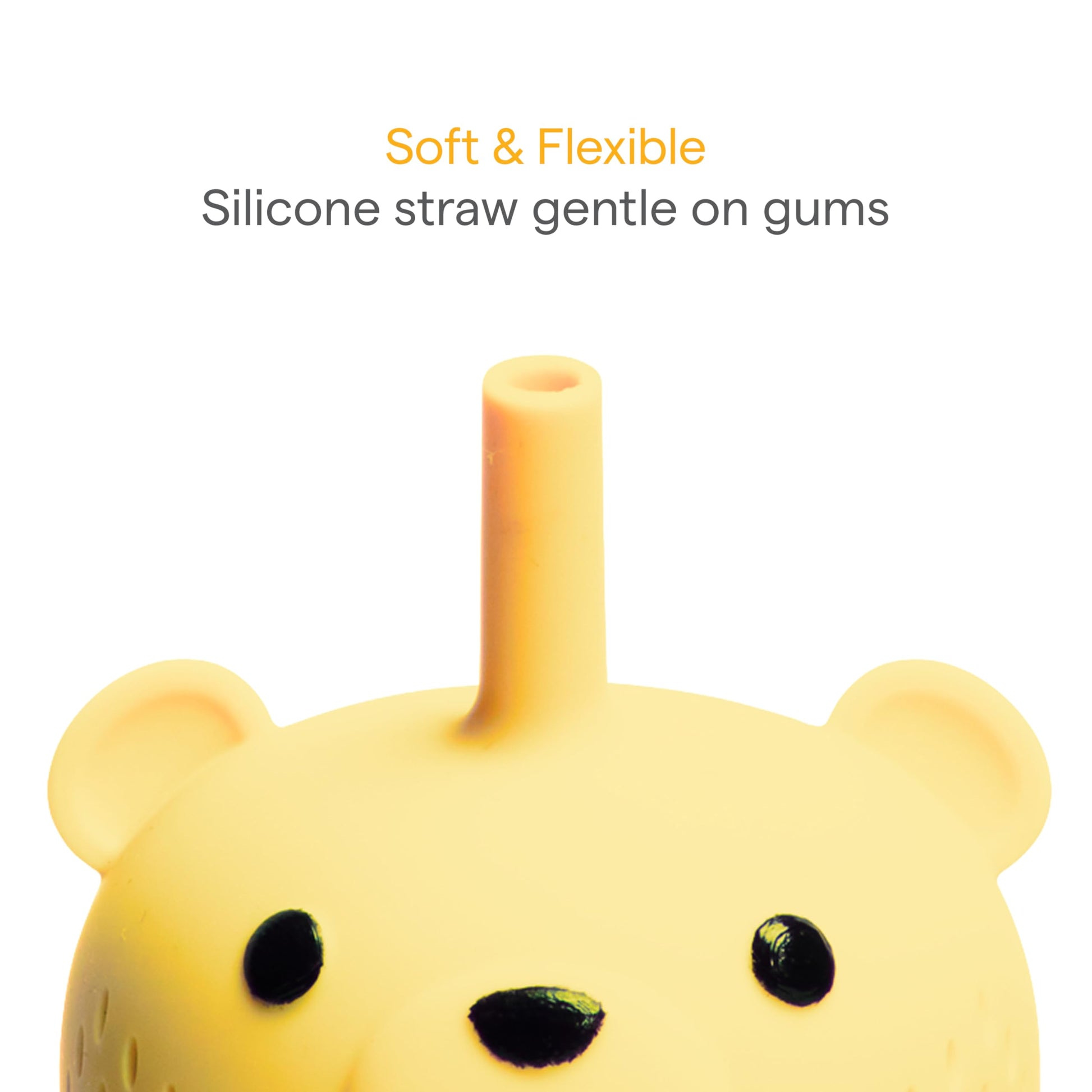 Baby holding yellow honey bear straw cup for independent drinking