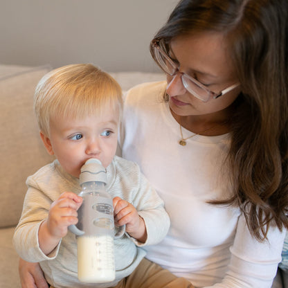 BPA free infant straw bottle with packaging and cleaning brush accessories