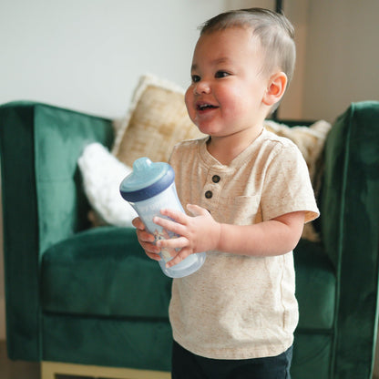 Double-wall insulated plastic child cup showing the authentic imported packaging
