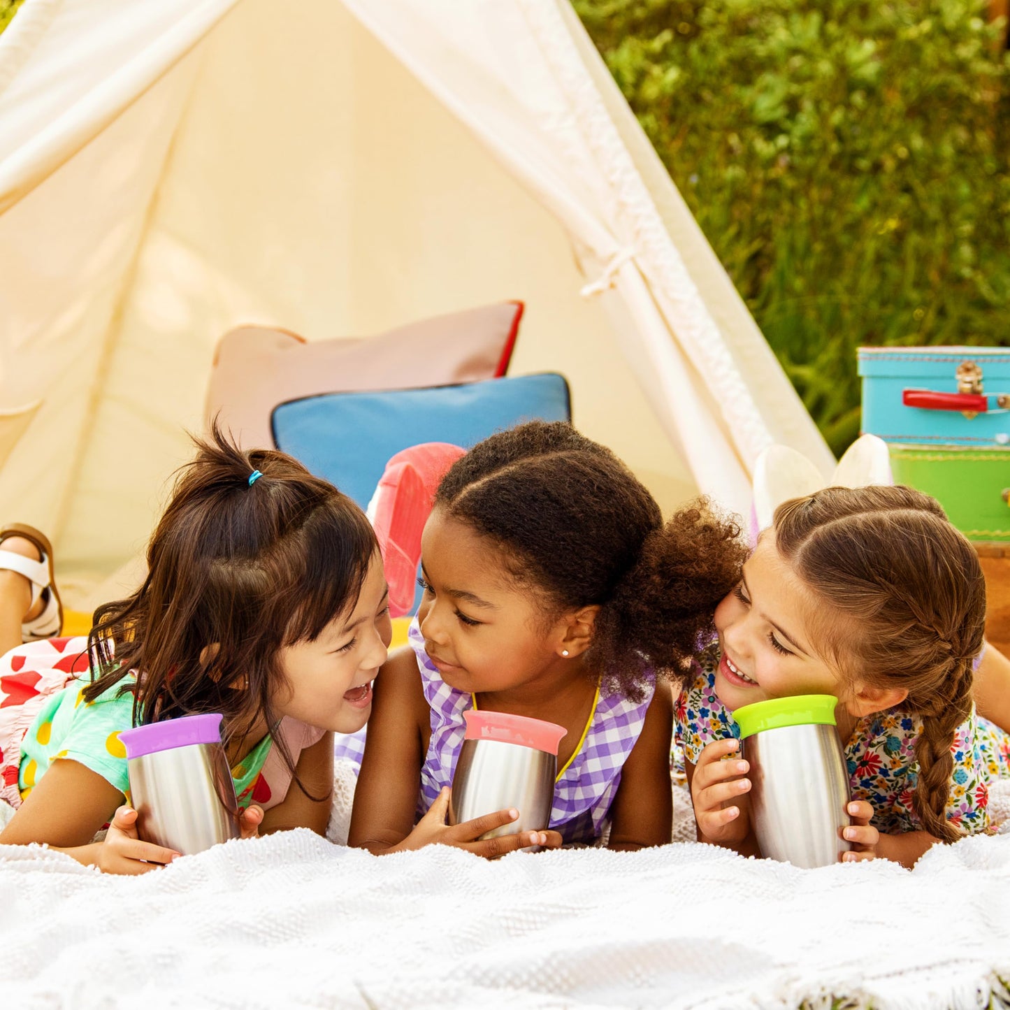 Munchkin 10 Ounce toddler cup showing the secure lid attached for outdoor travel.