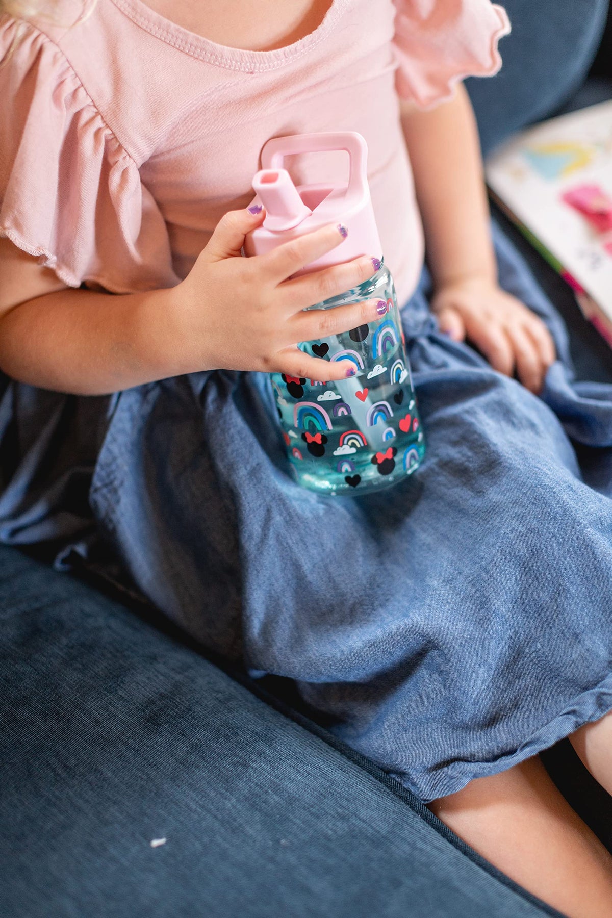 Authentic USA imported Simple Modern plastic cup being held by a child to show the small hands friendly size.