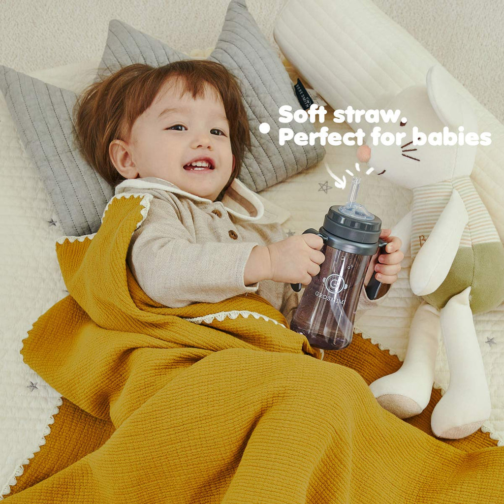 Side profile of the customizable Grosmimi magic sippy container highlighting fluid ounce measurements