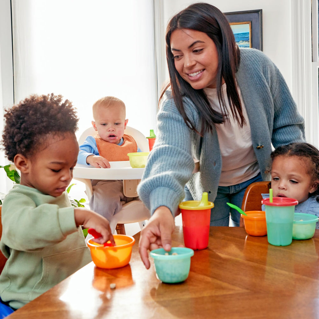 Close-up of valve-free spill proof snap-on lids on bright children cups