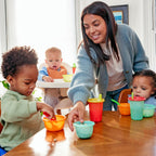 Close-up of valve-free spill proof snap-on lids on bright children cups