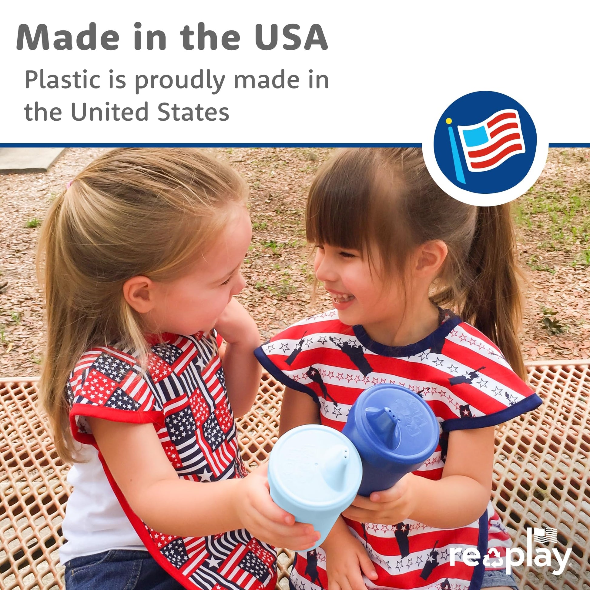 Four true blue Re-Play reusable toddler cups stacked neatly together on a clean kitchen counter.