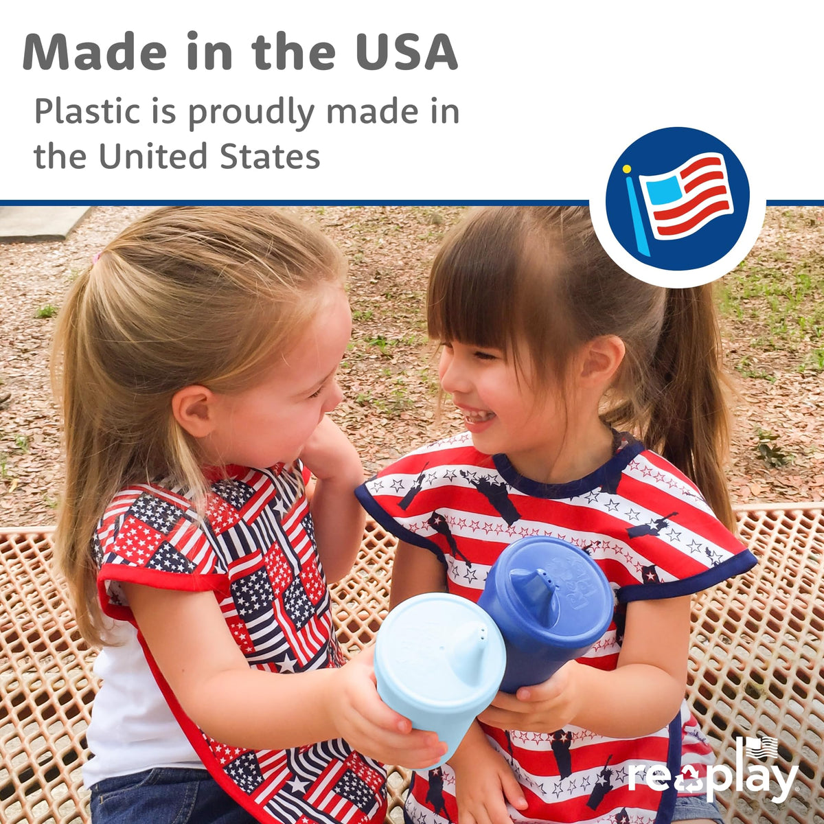 Four true blue Re-Play reusable toddler cups stacked neatly together on a clean kitchen counter.