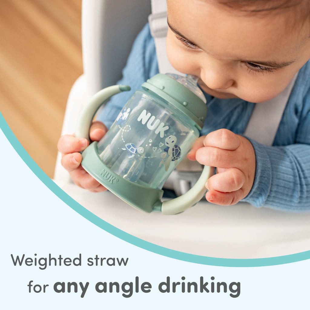 NUK BPA free learner straw cup being disassembled for cleaning