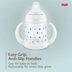 NUK premium infant sippy cup being held by a baby showing grip support
