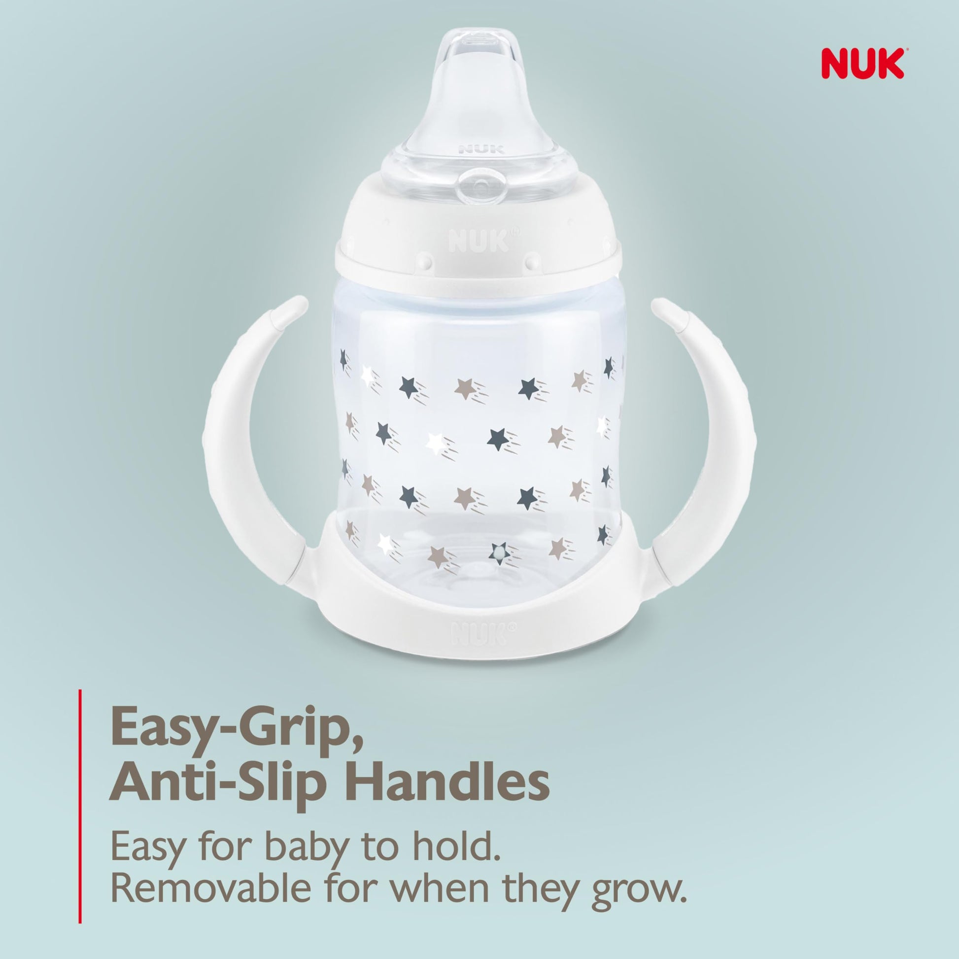 NUK premium infant sippy cup being held by a baby showing grip support