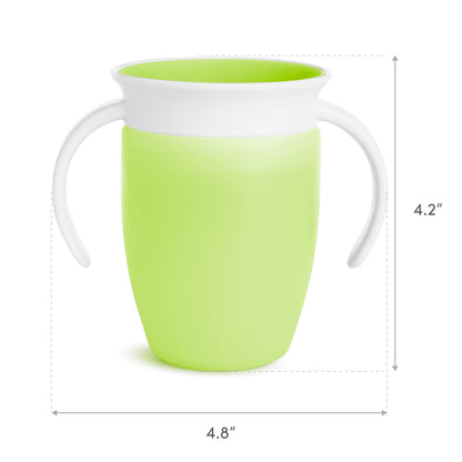 Munchkin Miracle 360 blue and green leak proof toddler cups sitting on a baby high chair.