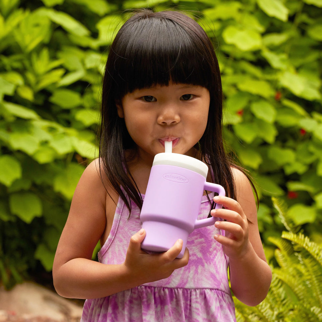 Lilac Infantino sippy cup inside a car seat cup holder