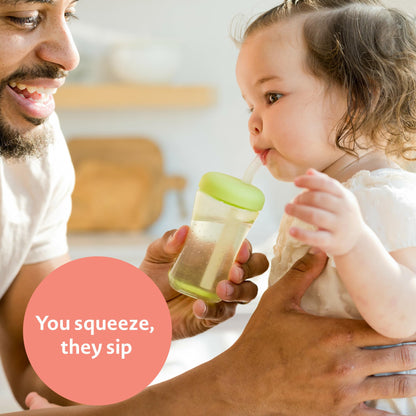 The First Years toddler straw cup showing the squeezable design feature