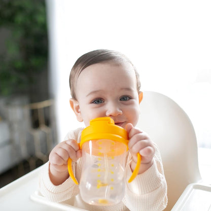 Dr. Brown's spill proof baby cup with the travel lid securely closed for transport.