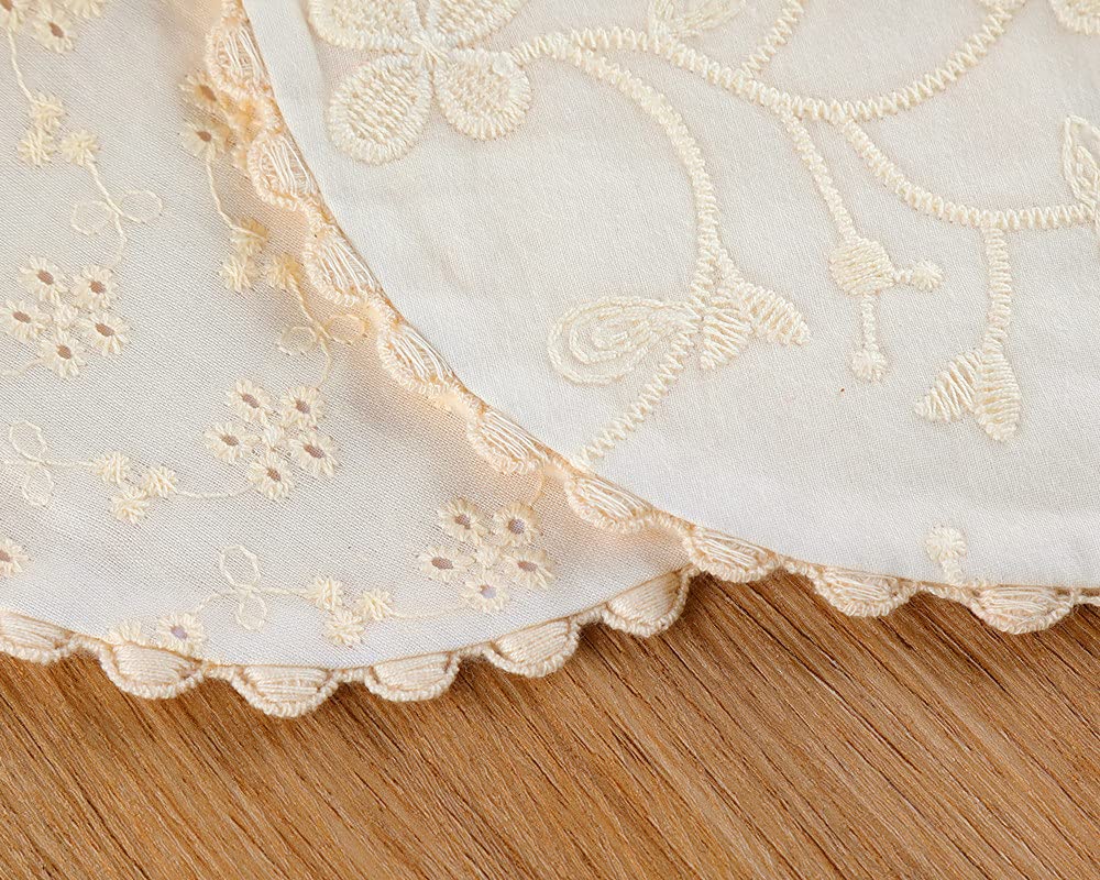 Handmade cotton bib with pom pom lace detail