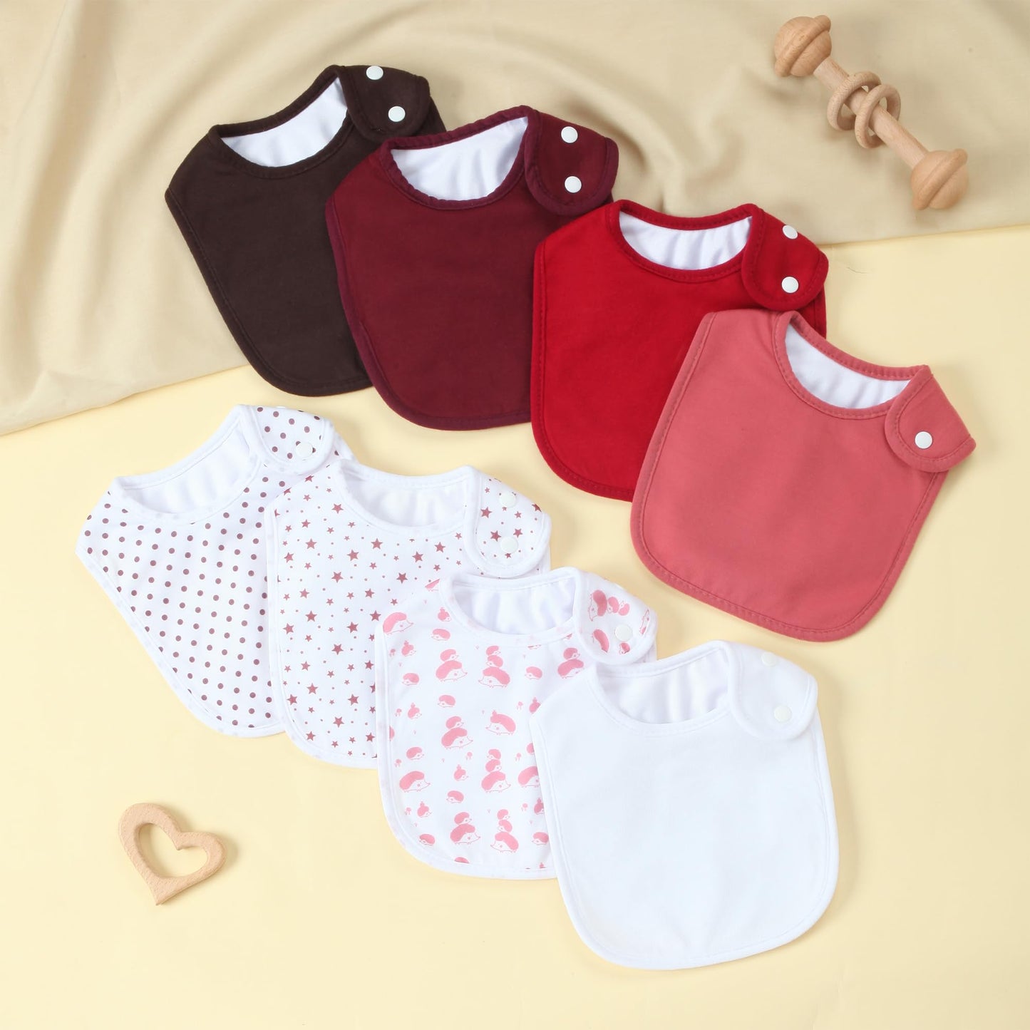 Set of newborn bandana bibs showing waterproof backing