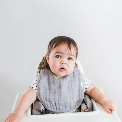 Five count pack of Green Sprouts organic muslin bibs