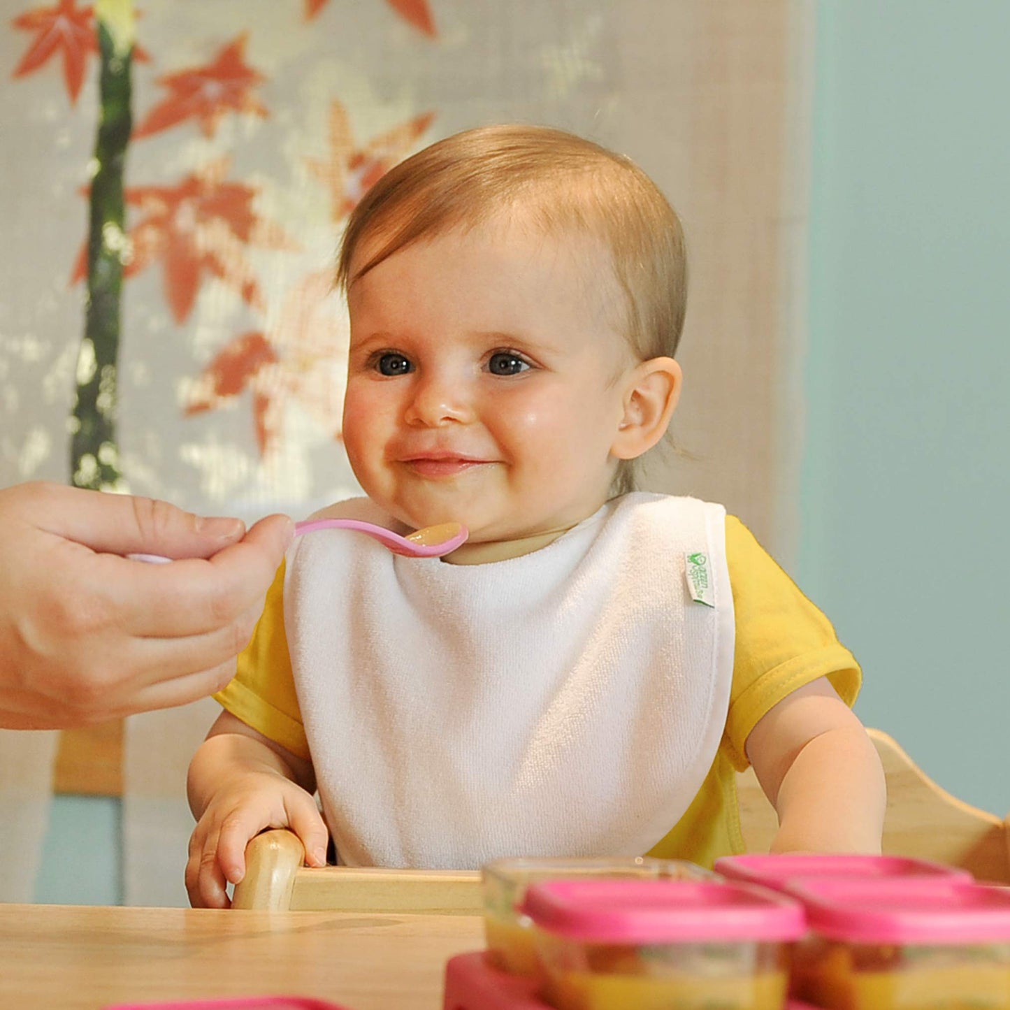Multi-colored Green Sprouts waterproof bibs for infants