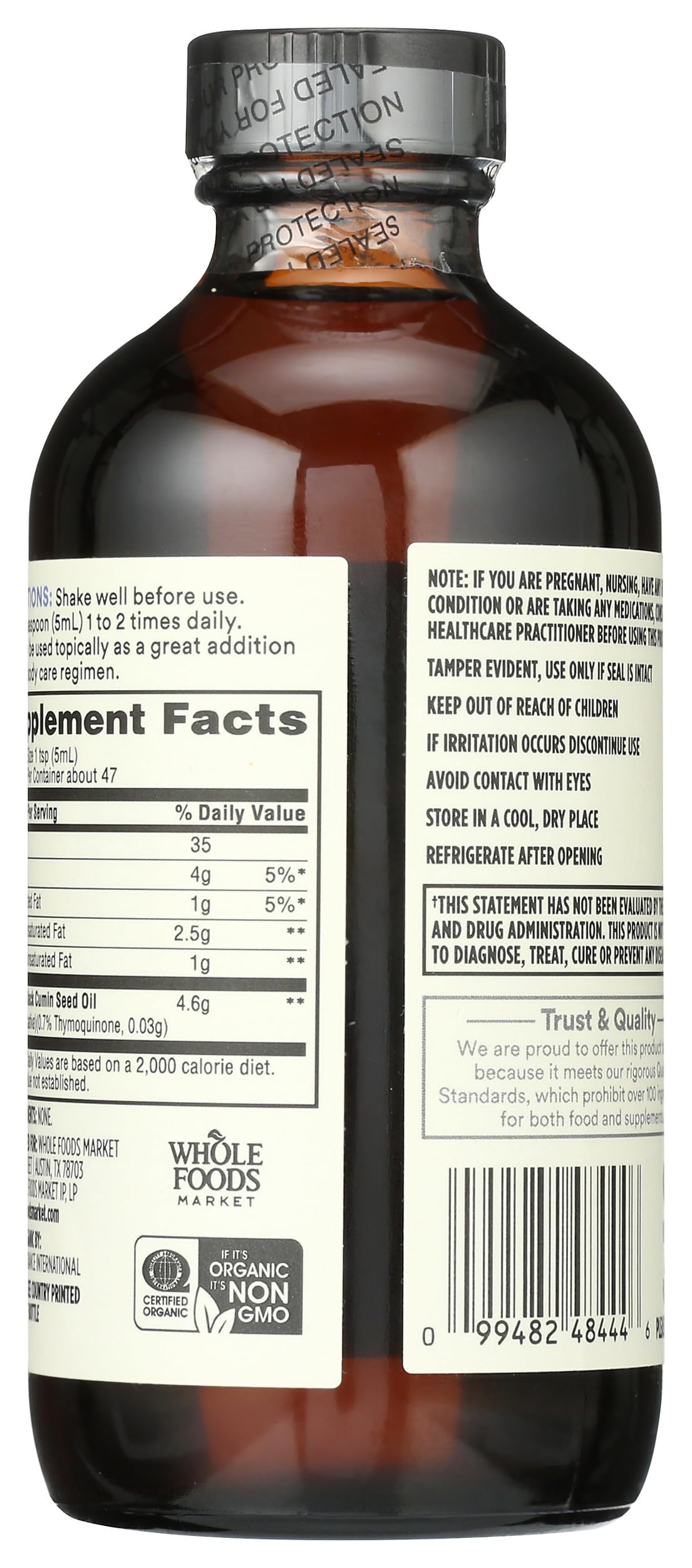 Back label of Whole Foods Market Organic Black Seed Oil detailing nutritional facts and organic certification