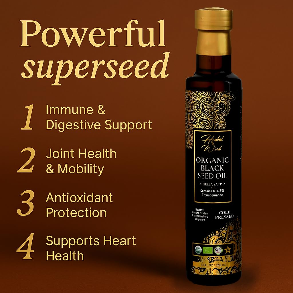 Cold pressed black cumin seed oil liquid being poured from the amber glass bottle.