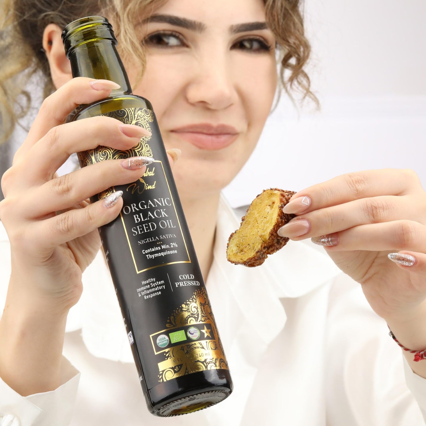 Authentic USA imported cold pressed organic black seed oil bottle close up view.