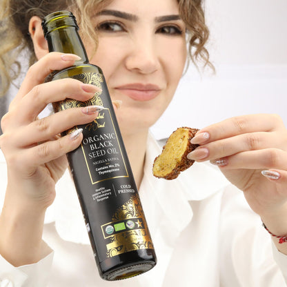 Authentic USA imported cold pressed organic black seed oil bottle close up view.