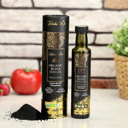 Herbal Wind vegan non GMO black cumin seed oil showing pure golden liquid color.
