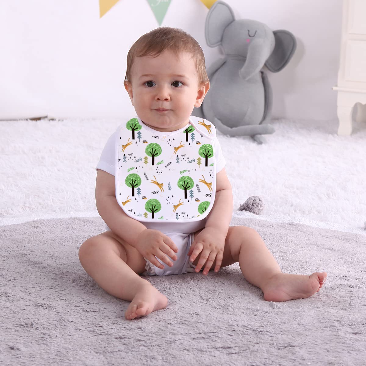 Maiwa baby bibs showcasing adjustable snap buttons and soft cotton texture.