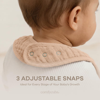 Baby wearing absorbent muslin feeding and teething bib