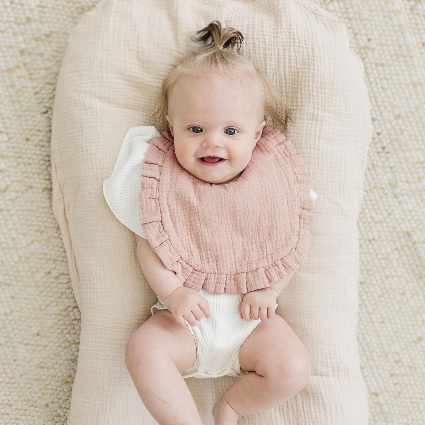 Adjustable snap closure detail on MairMore bibs