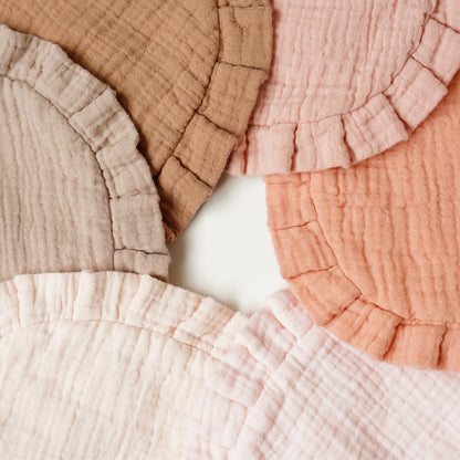 Collection of MairMore neutral colored muslin bibs