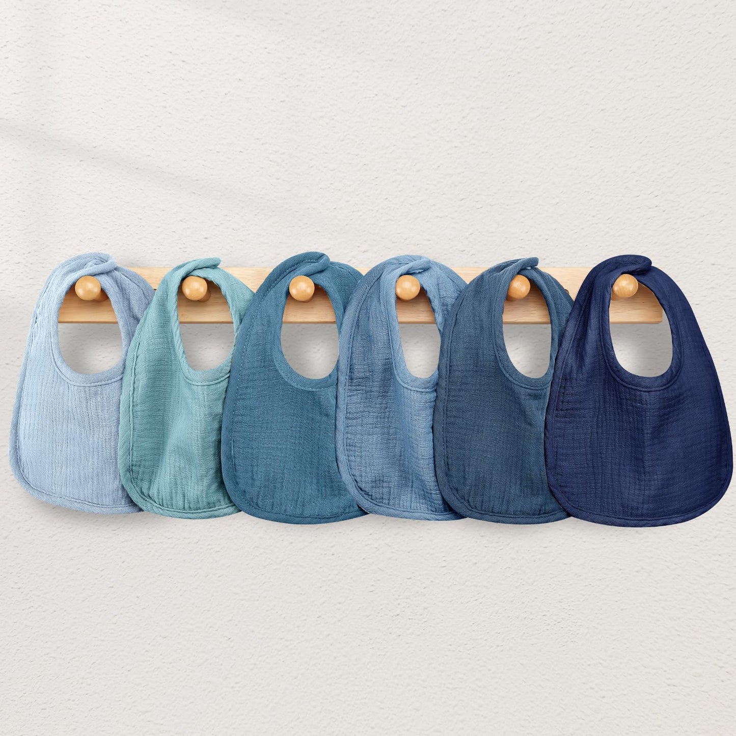Six pack of Wrrernsin newborn muslin bibs flat lay
