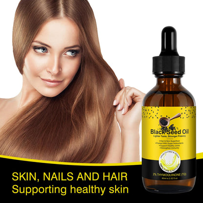 Yieegcm unrefined black seed oil for skin application showing non greasy texture on hands